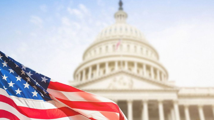 TechDogs-"An Image Showing An Exterior View Of The U.S. Government Building With The American Flag"